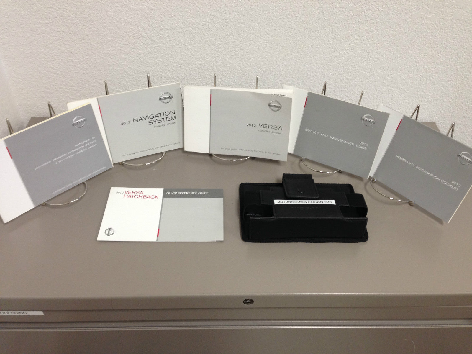 2012 Nissan Versa Genuine OEM Owner's Manual Set with Navigation and Case
