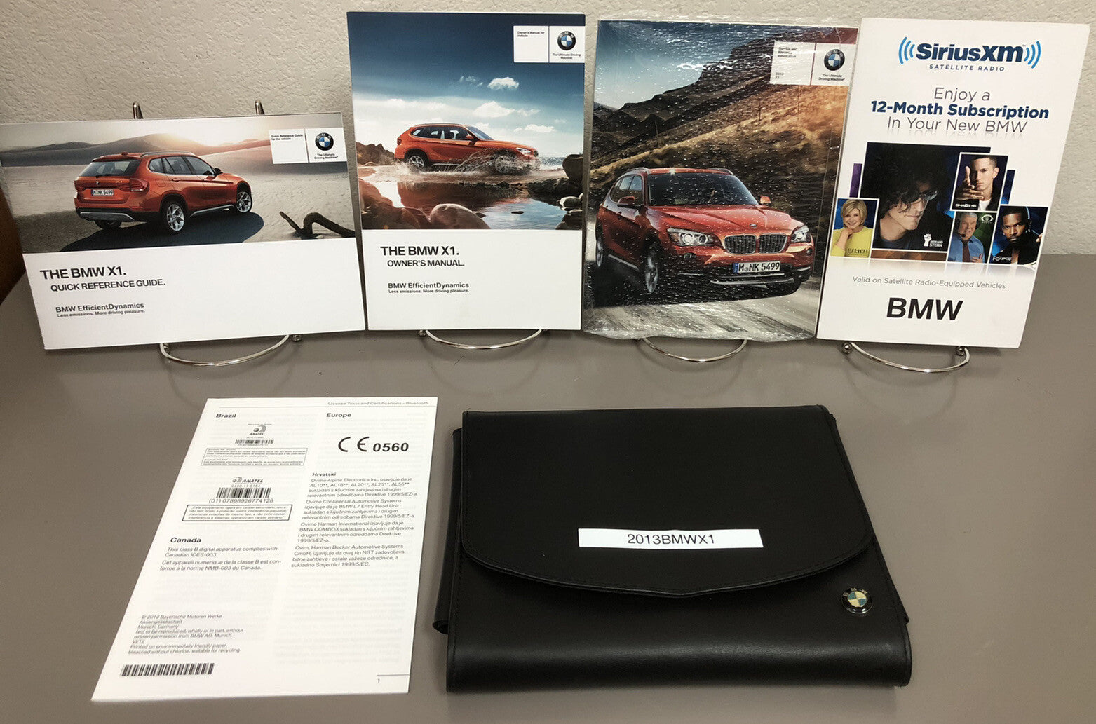 2013 BMW X1 Genuine OEM Owner's Manual Set with iDrive/Navigation and BMW Case