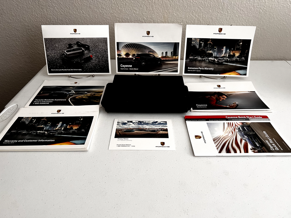 2019 Porsche Cayenne OEM Owner's Manual w/ several supplementals and logo case.